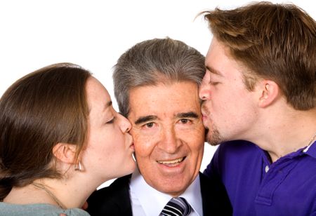 son and daughter kissing their father on the cheek - fathers day - over a white background