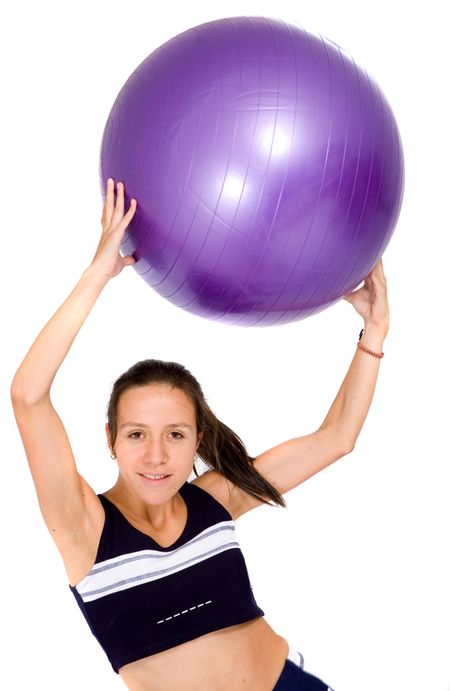 girl doing a fitness workout with a pilates ball over a white background