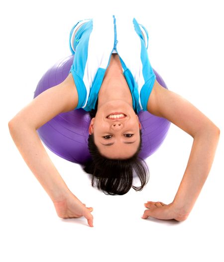 fitness girl doing pilates on a purple ball over a white background