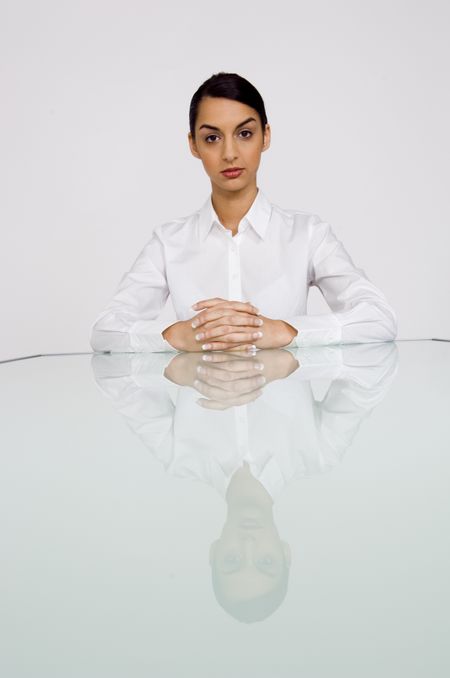 Business woman at end of table.