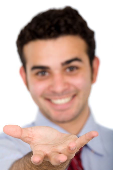 Business man displaying something on his hand over a white background