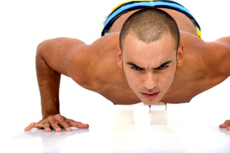 fitness man doing push ups isolated over a white background