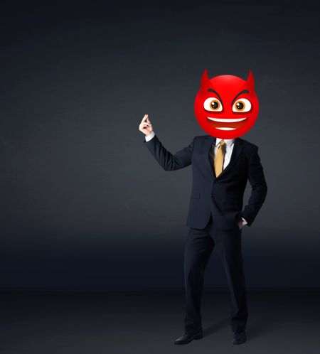 Funny businessman wears devil smiley face