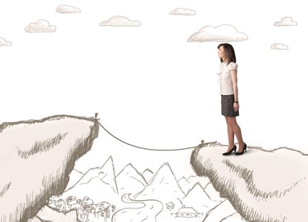 Businesswoman standing on the hand drawn edge of mountain