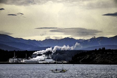 Retro-styled watercolor landscape of paper mill, with plumes of smoke and steam, in Port Townsend, Washington, USA, with Olympic Mountains in background and sailboat in foreground 