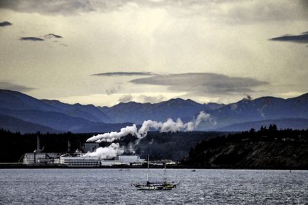 Retro-styled watercolor landscape of paper mill, with plumes of smoke and steam, in Port Townsend, Washington, USA, with Olympic Mountains in background and sailboat in foreground