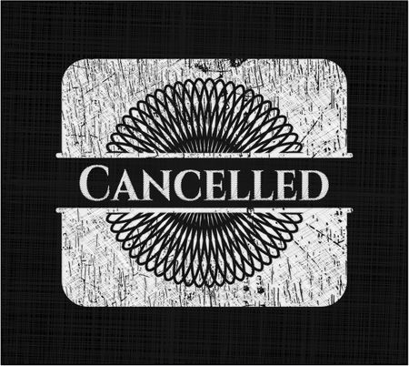 Cancelled chalk emblem written on a blackboard