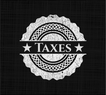 Taxes chalk emblem written on a blackboard
