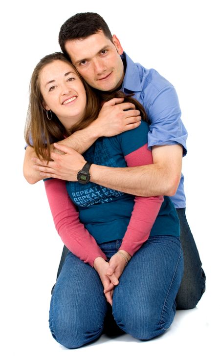 couple portrait sitting on the floor over a white background