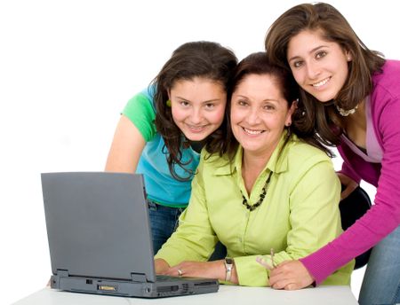 family on a laptop computer smiling - isolated over a white background