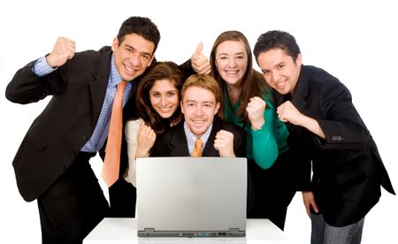 Business success team in an office in front of a laptop computer over a white background