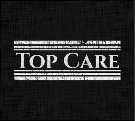 Top Care chalkboard emblem written on a blackboard