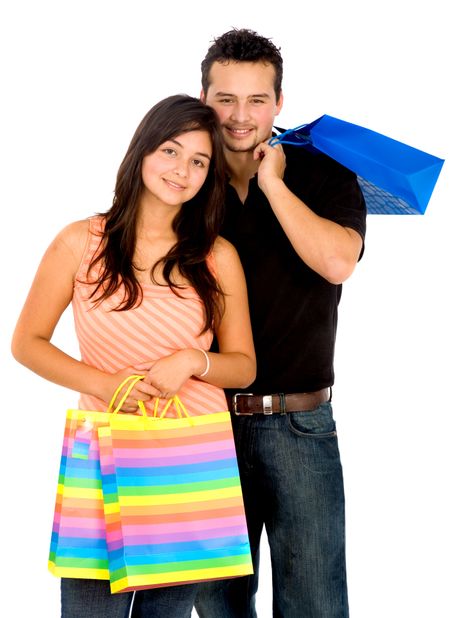 Couple holding shopping bags - isolated over a white background