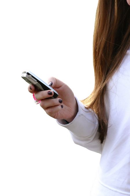 girl sending an sms from a mobile