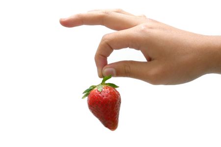 hand holding a strawberry