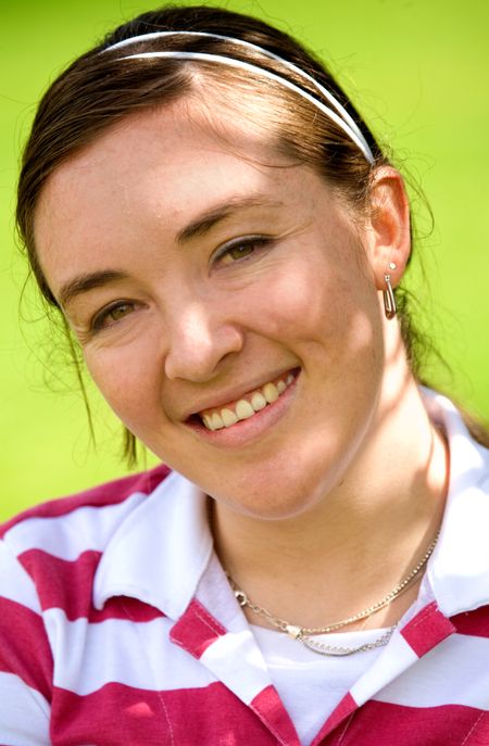 casual girl portrait outdoors over a green background