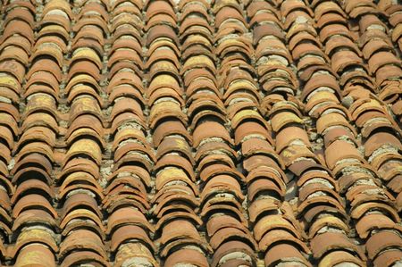 Rows of deep orange terra-cotta tiles on roof