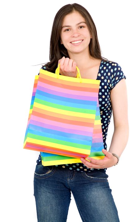 Casual girl with shopping bags - isolated over a white background