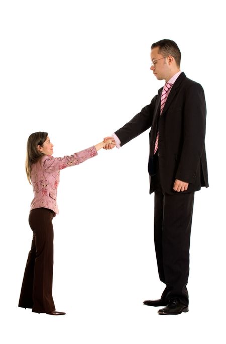 business couple doing a handshake where the businessman is a lot bigger than the businesswoman - good concept for merging companies - isolated over a white background