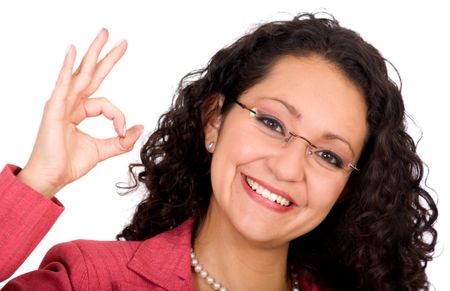 Business woman with glasses doing the ok sign - isolated over a white background