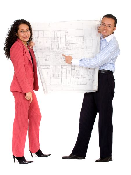 couple planning their house with some blueprints - isolated over a white background