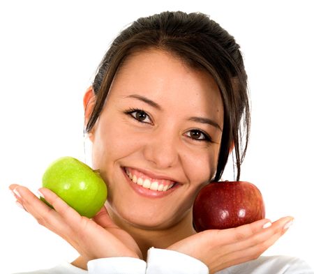 girl smiling while holding apples - isolated over a white background