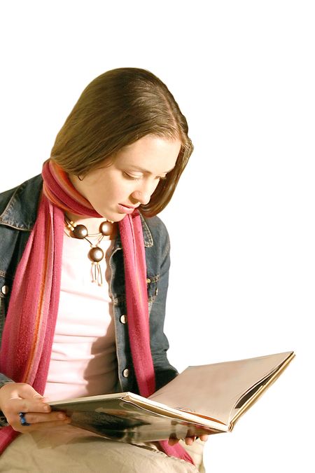 girl reading a book over a white background