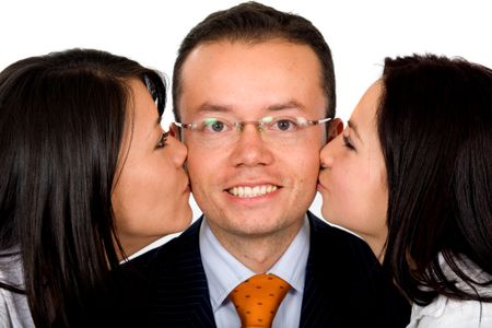 Business man with two girls kissing him at the same time isolated over a white background