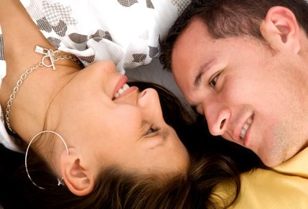 Beautiful couple smiling while facing at each other