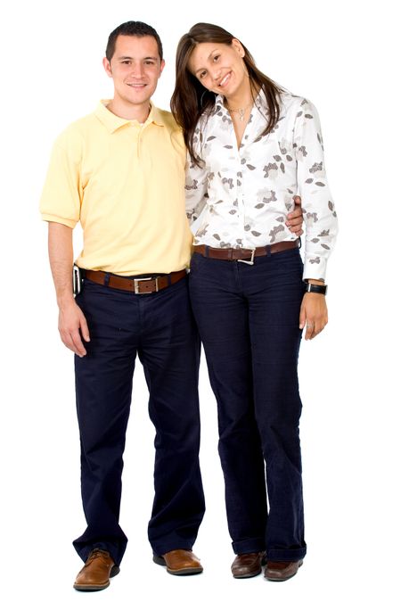 young couple smiling and standing next to each other - isolated over a white background