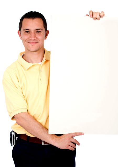 Casual guy holding a banner add isolated over a white background