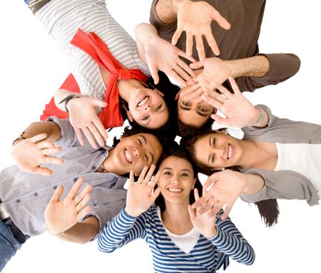 Group of friends with their heads together on the floorwaving isolated