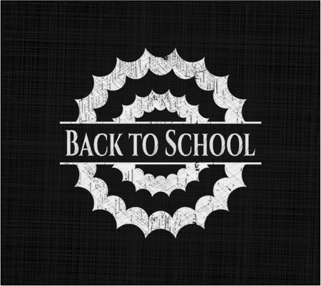 Back to School chalk emblem written on a blackboard