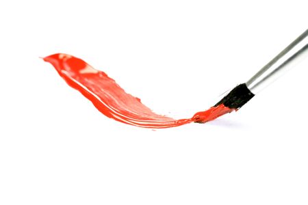 Red paint stroke with brush on white background