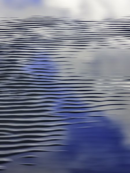 Abstract pattern of wave-washed sand, with motion blur, in intertidal zone of beach along Pacific coast of Olympic Peninsula in Washington, for themes of nature, transience, the environment