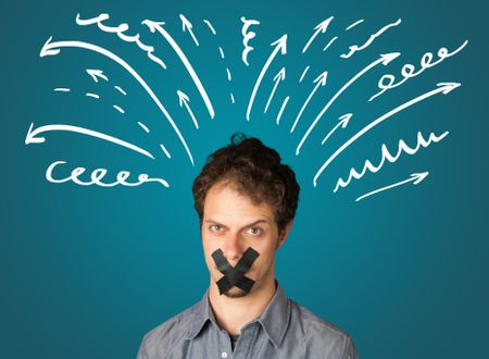 Young man with taped mouth and white drawn lines and arrows around his head  