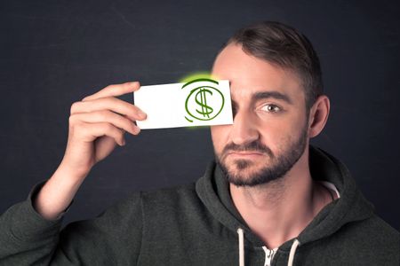 Guy holding a paper with hand drawn green dollar sign