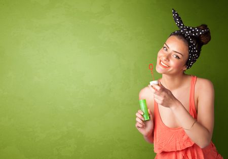beautiful-woman-blowing-soap-bubble-copyspace-334000319 Beautiful woman blowing soap bubble on copyspace green background