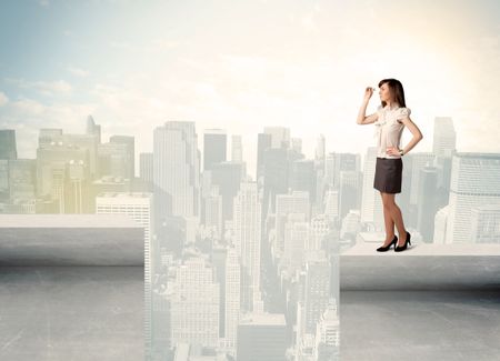 Businesswoman standing on the edge of rooftop with city background 