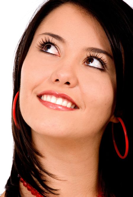 fashion woman portrait where she is smiling and looking up - isolated over a white background