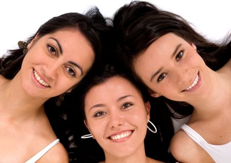 Beautiful happy female friends on the floor - isolated over a white background