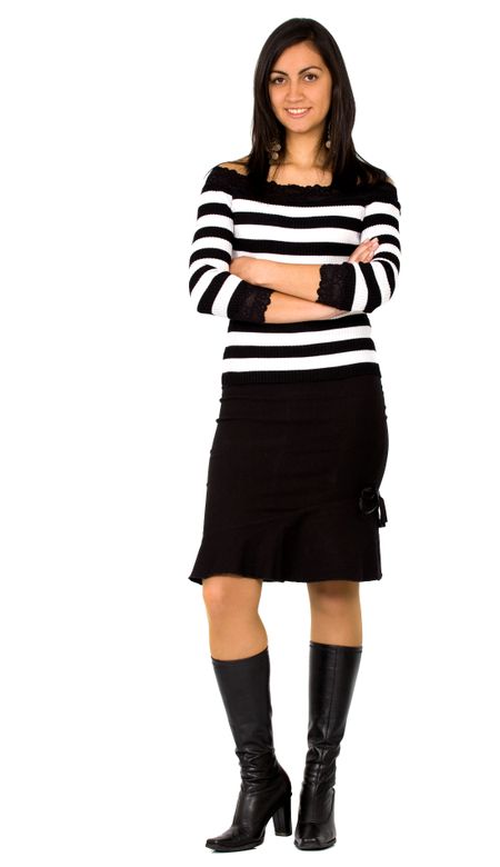 confident business woman standing wearing elegant clothes including a black skirt and a stripped top - isolated over a white background