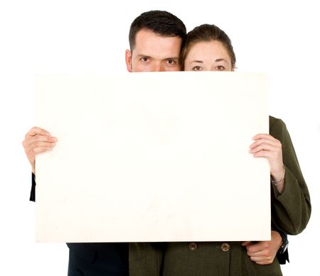 Business parners holding a white card board - isolated