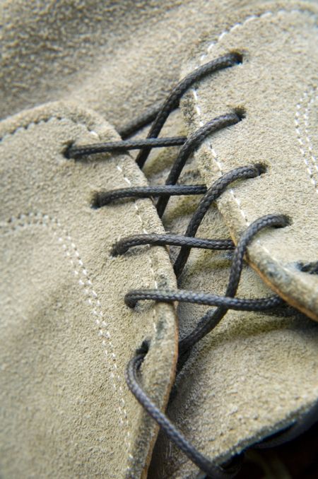 Black lace in men's suede shoe