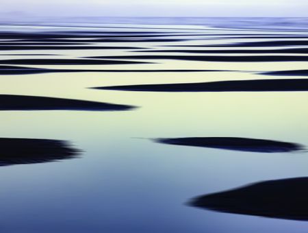 Abstract of sandbars and large tide pools on the Pacific coast of Olympic Peninsula in Washington, USA, for themes of nature, repetition, serenity, the environment (one of a series)