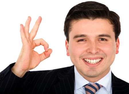 Business man doing the ok sign - smiling isolated over a white background