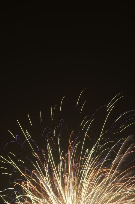 Top of fireworks burst with black copy space
