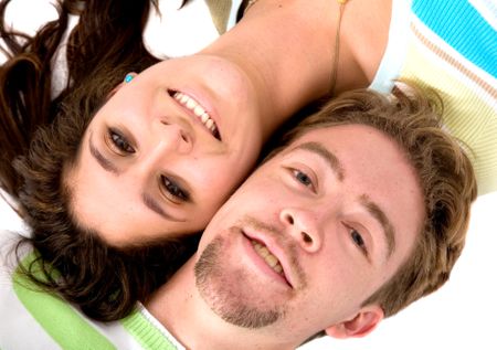 couple of lovers smiling on the floor - over a white background