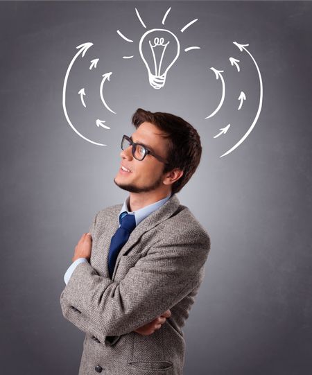 Young man standing and thinking with arrows and light bulb overhead