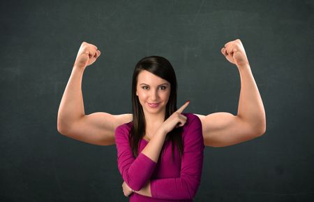 Pretty young woman with strong and muscled arms concept